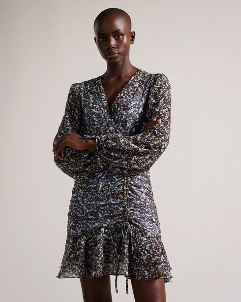 CHERELA-Dresses-It might be downright impossible to not look amazing in CHERELA. With its dropped waist and ruching on the front, pair with a sleek up-do and you're good to go.The fabric of this product is made of 100% recycled polyester. Using recycled polyester helps divert plastic waste from ending in landfills, and helps us to reduce our dependence on virgin materials. Mini dress Long sleeved V-neck Ruched front Ditsy floral print Dropped waist Awuoi is 5'10.5" / 1.79m and wears Light Blue in a Ted size